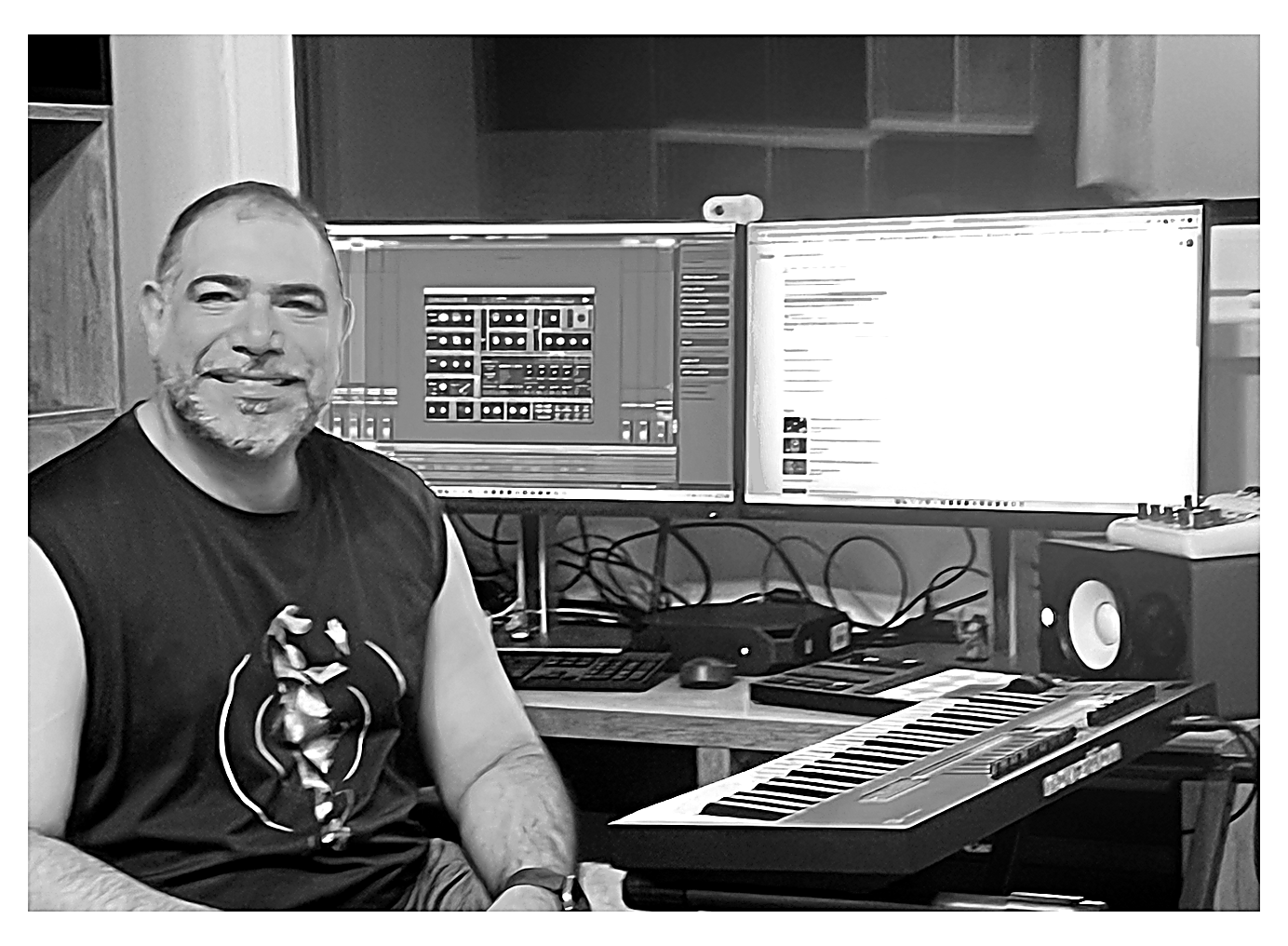 Piruz Afruz at his desk in the home studio, Ableton open with Talk Moonshine on the monitor, Novation keyboard, studio monitors
